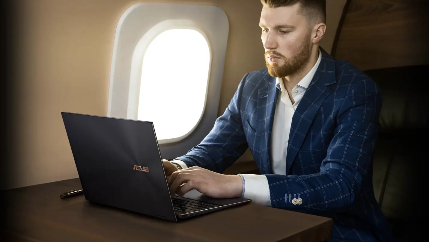 A business man on the plane using ASUS Zen Flip S